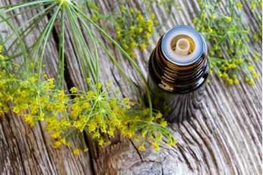 bigstock-a-bottle-of-dill-seed-oil-with-244673473